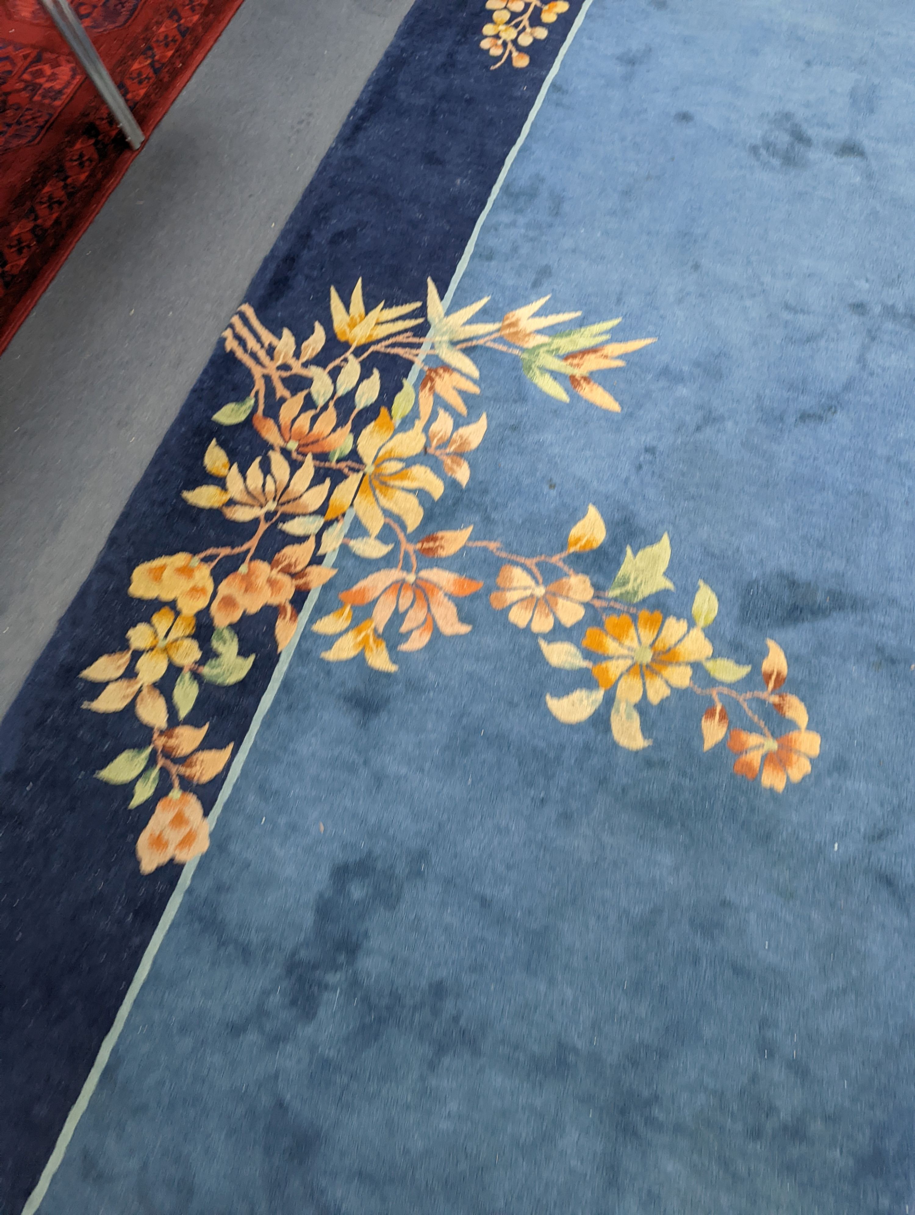 An early 20th century Art Deco Chinese blue ground floral carpet, 400 x 310cm